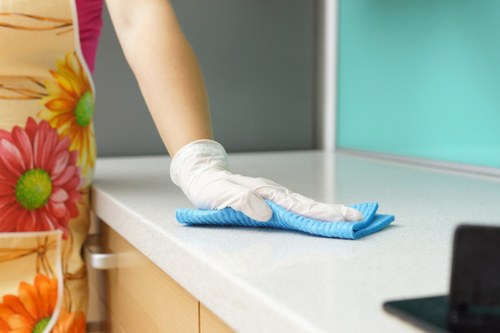 Carpet cleaning technician preparing equipment for a booked service